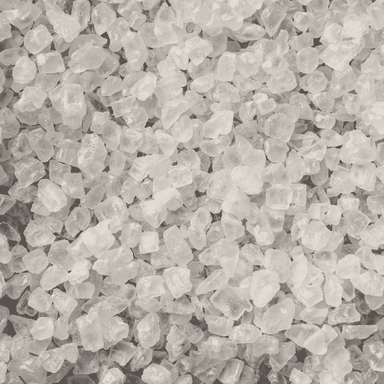 Coarse pan salt: a close heap of hard cubic crystals between one and three millimetres.